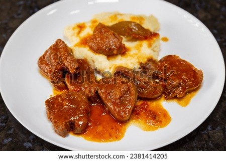 Traditional rustic Brazilian dish, beef tongue in Madeira sauce with mashed potatoes 