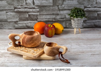 Traditional Sami Wooden Cups On A Wooden Table, On Wooden Planks Stands. Kuksa. Finnish Wooden Cups. Finnish Culture.