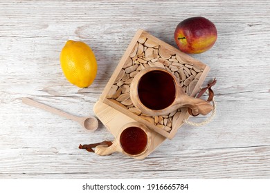 Traditional Sami Wooden Cups With Tea On A Wooden Table, On Wooden Planks Stands. Kuksa. Finnish Wooden Cups. Finnish Culture. View From Above.