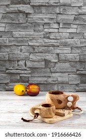 Traditional Sami Wooden Cups With Tea On A Wooden Table, On Wooden Planks Stands. Kuksa. Finnish Wooden Cups. Finnish Culture.