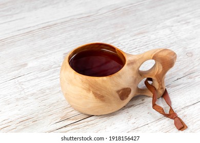 Traditional Sami Wooden Cups With Tea On A Wooden Table. Kuksa. Finnish Wooden Cups. Finnish Culture.