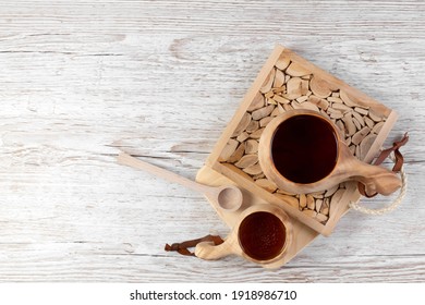 Traditional Sami Wooden Cups With Tea On A Wooden Table, On Wooden Planks Stands. Kuksa. Finnish Wooden Cups. Finnish Culture. View From Above.