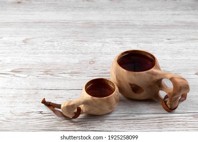 Traditional Sami Wooden Cups Whith Tea On A Wooden Table. Kuksa. Finnish Wooden Cups. Finnish Culture. Copy Space. 