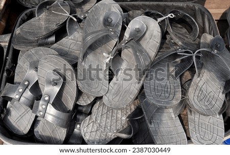 Traditional sandals made from car tire rubber at a flea market in Jakarta, Indonesia, taken from a high angle


