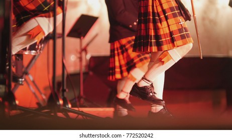 Traditional Scottish Band Musicians Singing With Bagpipes And Drums On The Stage