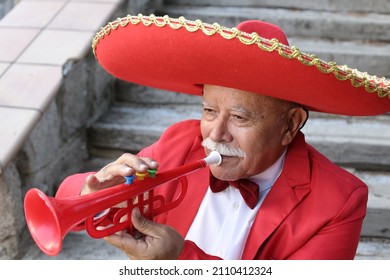 Traditional Senior Mexican Man Playing The Trumpet