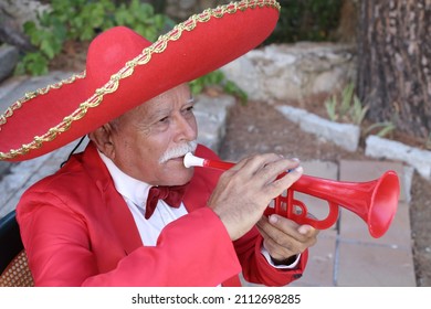 Traditional Senior Mexican Man Playing The Trumpet