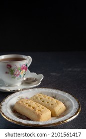 Traditional Shortbread and Cup of Tea, Selective Focus Dark Background with Copy Space Vertical