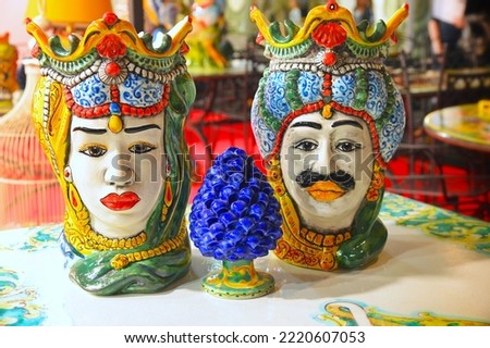 traditional Sicilian ceramics representing the couple of Moor's heads and the pine cone hissing of prosperity and luck