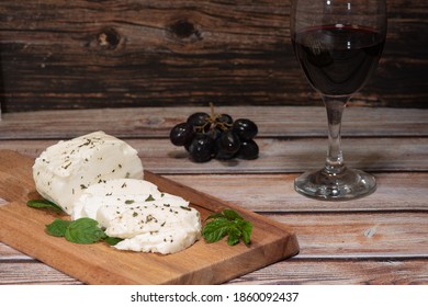 Traditional Slices Of Cyprus Halloumi Cheese Red Wine And Grapes On A Table