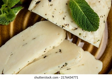 Traditional Slices Of Cyprus Halloumi Cheese With Mint. Healthy Eco Food. Food Recipe Background. Close Up.