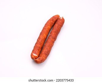 Traditional Smoked Pork Sausage, Long, Isolated. Polish Meat Sausage, Cold Cuts, A Packshot Photo For Package Design, Template. 