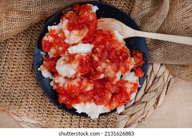 Traditional South African Pap And Sous, Maize Meal Covered In Tomato And Onion Relish