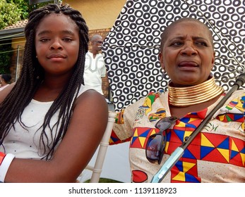 Traditional South African Wedding Between, Xhosa And Ndebele - Johannesburg, South Africa, 29 October 2017. Woman And Child At Reception Table.