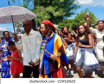 Traditional South African Wedding Between, Xhosa And Ndebele - Johannesburg, South Africa, 29 October 2017. Bride And Groom Followed By Singers.