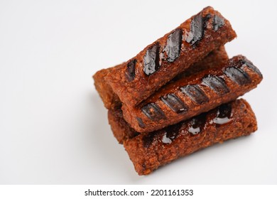 Traditional South European Skinless Sausages Cevapcici Made Of Ground Meat And Spices, Vegan Substitute Made Of Soy Protein, Stacked On White Background