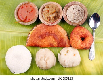 Traditional South Indian Breakfast With Dosa, Idly, Vada, Upma, Kesaribath With Spicy Indian Curry And Chutney