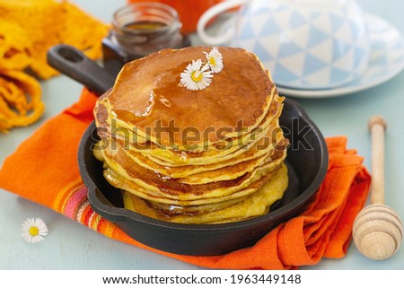 Traditional Southern Hoe Cakes (Johnny cakes) served with honey