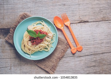 Traditional spaghetti with tomato sauce  - homemade healthy italian pasta on rustic wooden background