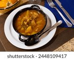 Traditional Spanish Estofado de Carne, hearty beef stew made with potatoes, carrots, onions, and other vegetables served for dinner