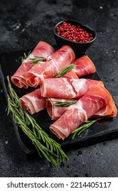 Traditional Spanish Jamon Serrano ham on marble board. Black background. Top view. - Shutterstock ID 2214405117
