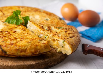 Traditional Spanish omelette with potatoes and zuuchini - Shutterstock ID 1932201935