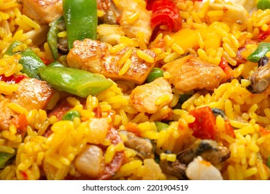 Traditional Spanish Paella With Seafood And Chicken Meat - Close Up View