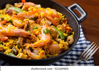 Traditional Spanish paella with seafood and chicken. Prepared in wook. 