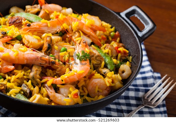 Traditional Spanish paella with seafood and chicken.\
Prepared in wook. 