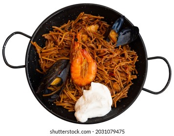 Traditional Spanish Seafood Dish Fideua With Aioli Sauce In A Restaurant. Isolated Over White Background