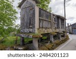 A hórreo is a traditional storage building for crops such as corn and grain. It is a listed building in the Spanish region of Galicia. Seen on the Via de la Plata pilgrimage route near Ourense, Cea