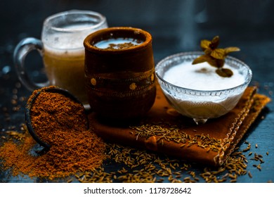 Traditional Summer Drink I.e. Is Most Popular In Asia And India I.e. Chas Or Chaas Or Buttermilk Or Chhaachh In A Clay Glass With Curd And Coriander Powder And Salt On Wooden Surface,Close Up.