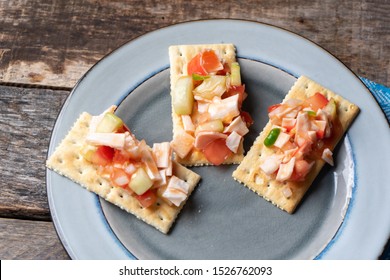 Traditional Surimi Crab Ceviche With Cucumber And Tomato On Wooden Background