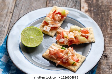 Traditional Surimi Crab Ceviche With Cucumber And Tomato On Wooden Background