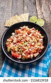 Traditional Surimi Crab Ceviche With Cucumber And Tomato On Wooden Background