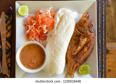 Traditional Swahili Food With Ugali And Grilled Fish