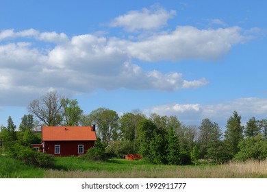 Traditional Swedish Countryside With A Red House. Summer Time And Nice Weather Outside. Stockholm, Sweden, Scandinavia, Europe.