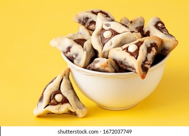 Traditional sweets Hamantashen cookies for Jewish holiday of Purim.Purim celebration concept. Jewish carnival holiday background 