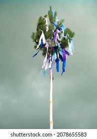 Traditional Tall Wooden Maypole Erected With Ribbons And Small Flag- May Pole And Celebration