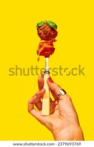 Traditional taste. Woman holding fork with spaghetti and meatball over yellow background. Tomato sauce and basil. Concept of Italian food, cuisine, taste, cooking, menu. Pop art. Poster, ad