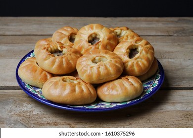 Traditional Tatar Food Peremech On Blue Plate On Wooden Table, Black Background. Side View.