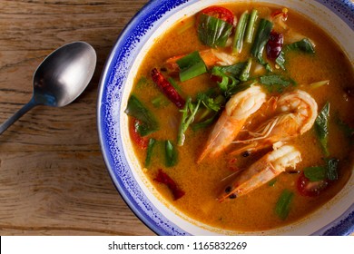 Traditional thai cuisine, Tom yum goong, Spicy shrimp soup on wooden background - Powered by Shutterstock