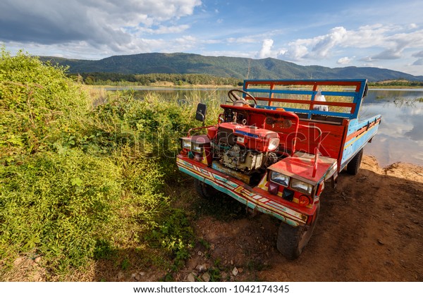 Traditional\
Thai farming truck in countryside of\
Thailand
