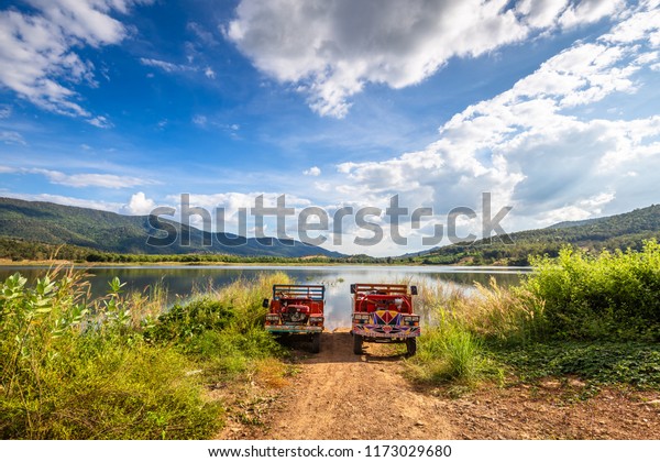 Traditional Thai farming trucks on the bank of\
the lake, countryside of\
Thailand