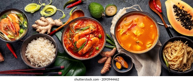 Traditional Thai food on dark background. Oriental food concept. Top view, flat lay, panorama - Shutterstock ID 2093944462