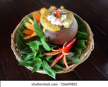 Traditional Thai Food Steamed Fish Curry Paste In The Jar With Vegetables As A Side Dish.