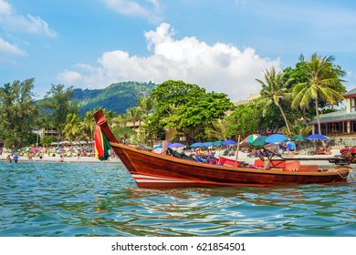 Traditional Thai long boat on Kata beach - one of the best beaches in Phuket, Thailand 