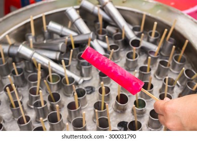 Traditional Thai Popsicle Maker Made By Using Juice Pour To Stainless Tube And Soak Into A Tank Then Rotate The Top;this Agitates The Ice And Settles The Tubes