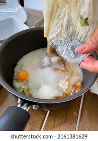 Traditional Thai Rice Soup Khao Tom For Breakfast From A Plastic To Go Bag In A Pot Ready To Eat