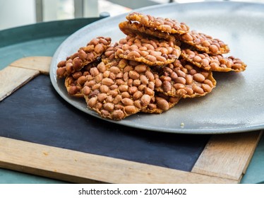 Traditional Thai Snack : Peanut Crackers Made From Nuts And Flour To Fry On Plate. Deep Fried Bean Cookies Peanut, Selective Focus.